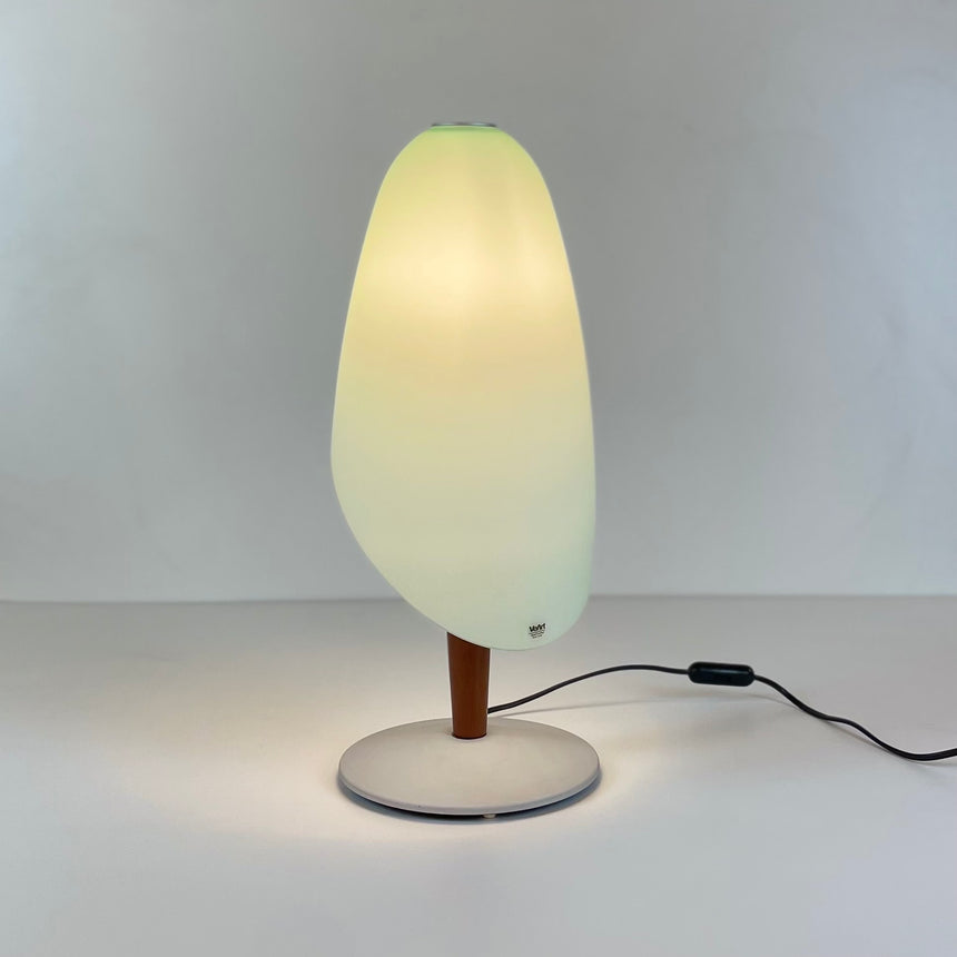 Pair of table lamps designed by Bruno Gecchelin for Guzzini during the 1980's. White plastic with a rubber band that allows the closure of the lamp which is divided into 2 parts. -  Paire de lampe de table dessinées par Bruno Gecchelin pour Guzzini dans les années 80. Plastique blanc avec une bande de caoutchouc qui permet la fermeture de la lampe qui est scindée en 2 parties